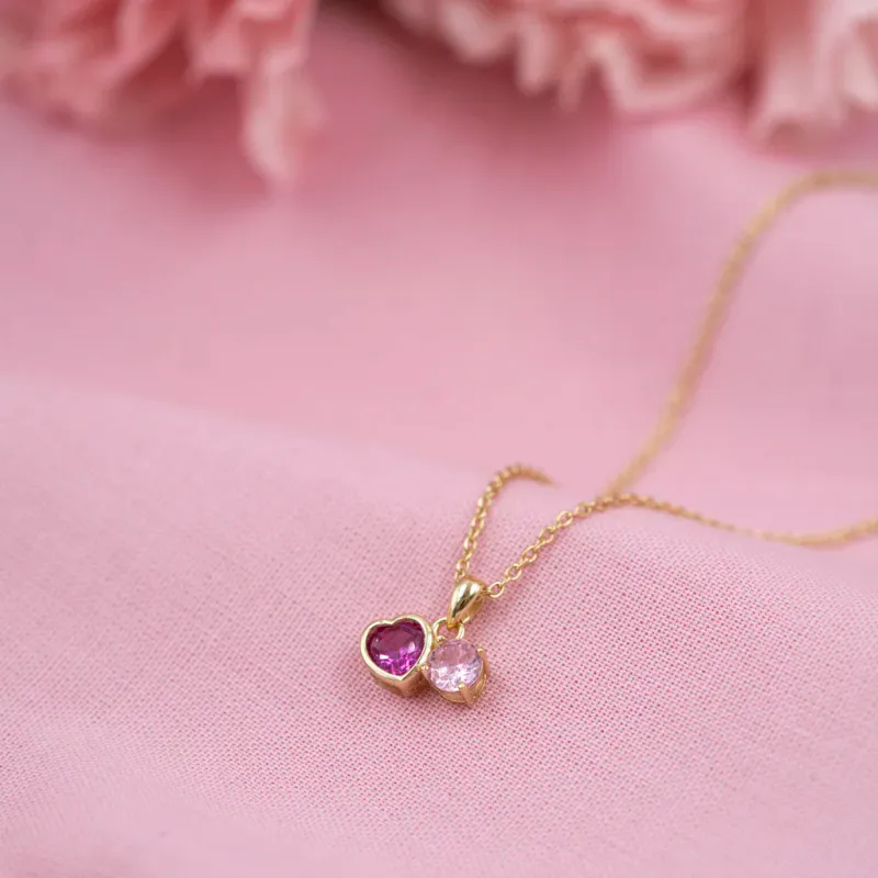 Smykke i sølv med rosa zirkonia